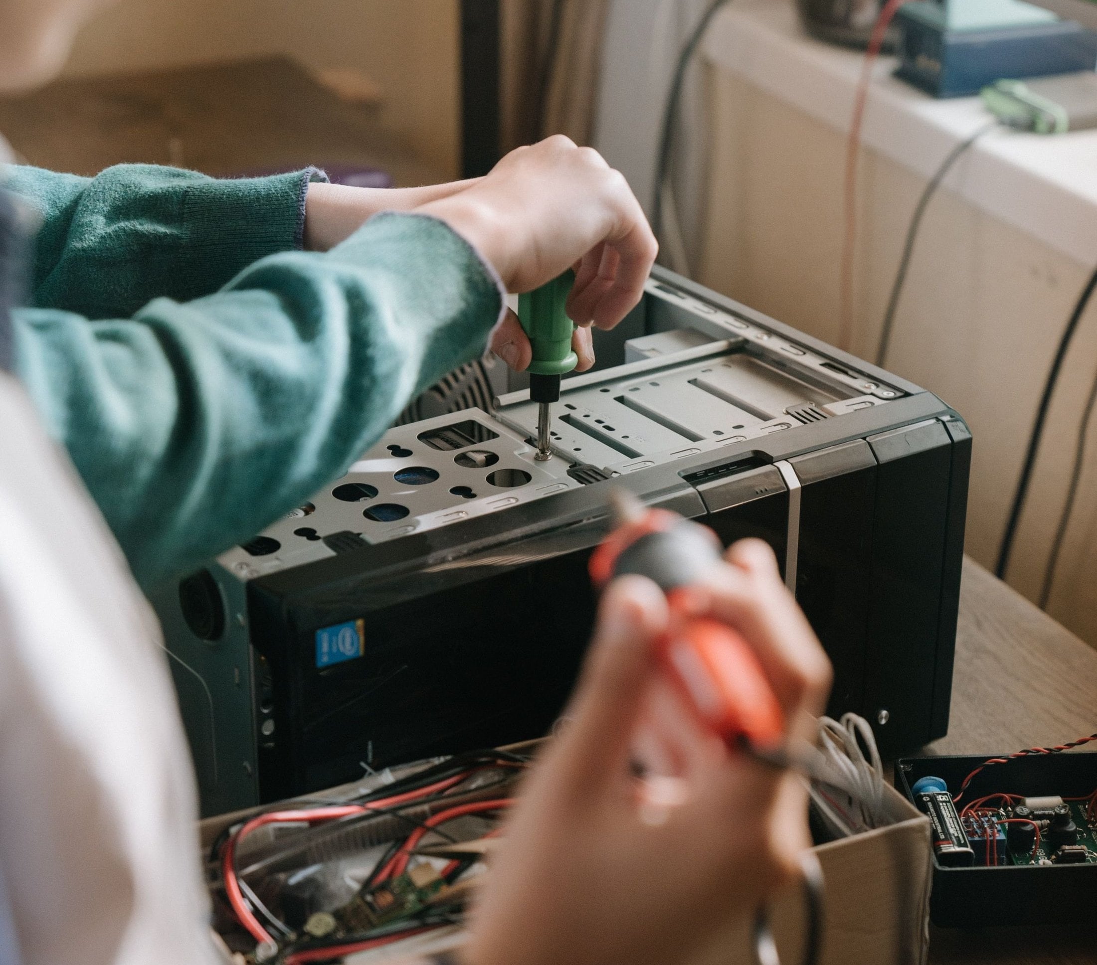 A technician repairing an appliance on the bench