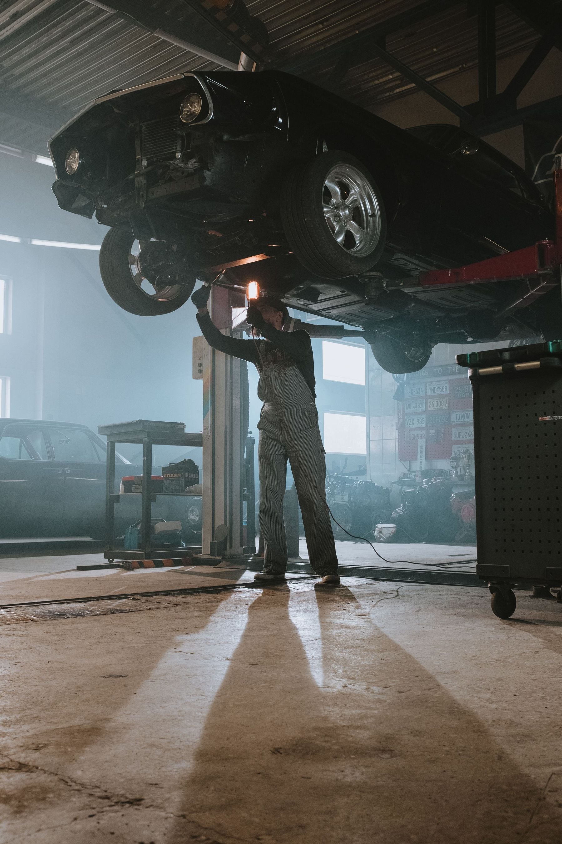 A mechanic working on a car